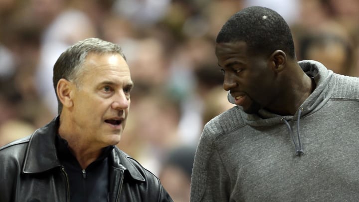 Feb 13, 2014; East Lansing, MI, USA; Michigan State Spartans football head coach Mark Dantonio talks with former Michigan State Spartans forward Draymond Green during the 2nd half of a game at Jack Breslin Student Events Center. MSU won 85-70. Mandatory Credit: Mike Carter-USA TODAY Sports