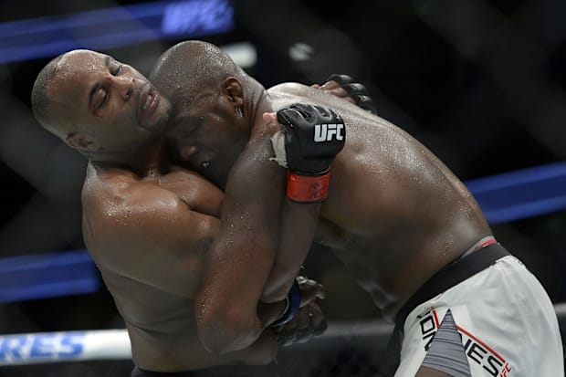 Jon Jones and Daniel Cormier clinch up during UFC 214 at Honda Center. 