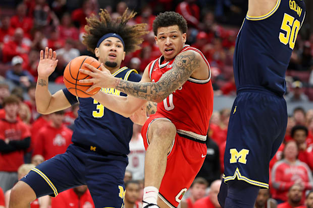Feb 16, 2025; Columbus, Ohio, USA;  Ohio State Buckeyes guard John Mobley Jr. (0) drives to the basket as Michigan Wolverines