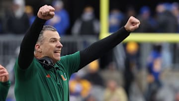Nov 29, 2025; Pittsburgh, Pennsylvania, USA;  Miami Hurricanes head coach Mario Cristobal reacts after a touchdown against the Pittsburgh Panthers during the third quarter at Acrisure Stadium. Mandatory Credit: Charles LeClaire-Imagn Images