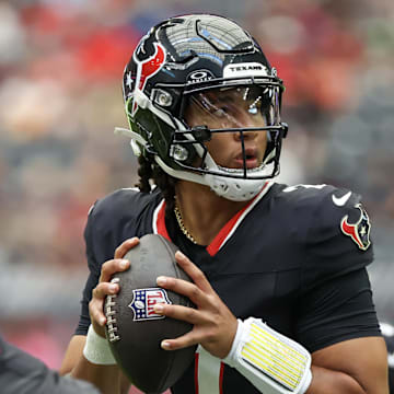 Aug 17, 2024; Houston, Texas, USA; Houston Texans quarterback C.J. Stroud (7) drops back to pass against the New York Giants in the first quarter at NRG Stadium. Mandatory Credit: Thomas Shea-Imagn Images