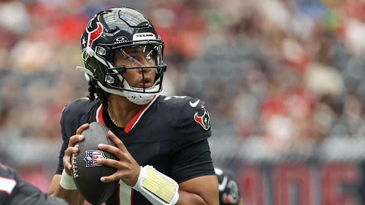 Aug 17, 2024; Houston, Texas, USA; Houston Texans quarterback C.J. Stroud (7) drops back to pass against the New York Giants in the first quarter at NRG Stadium. Mandatory Credit: Thomas Shea-Imagn Images