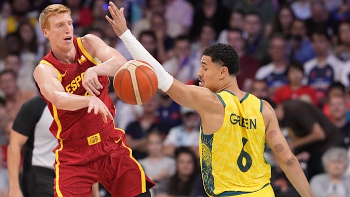 Jul 27, 2024; Villeneuve-d'Ascq, France; Spain point guard Alberto Diaz (9) passes the ball away from Australia small forward Josh Green (6)  in men's Group A play during the Paris 2024 Olympic Summer Games at Stade Pierre-Mauroy. Mandatory Credit: John David Mercer-USA TODAY Sports