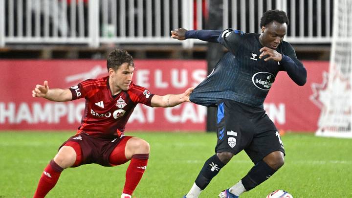 Atletico Ottawa midfielder Ballou Tabla has his shirt pulled as he tries to elude Toronto FC defender Jackson Gilman. Unfortunately, TFC did not elude the upset on Tuesday night.