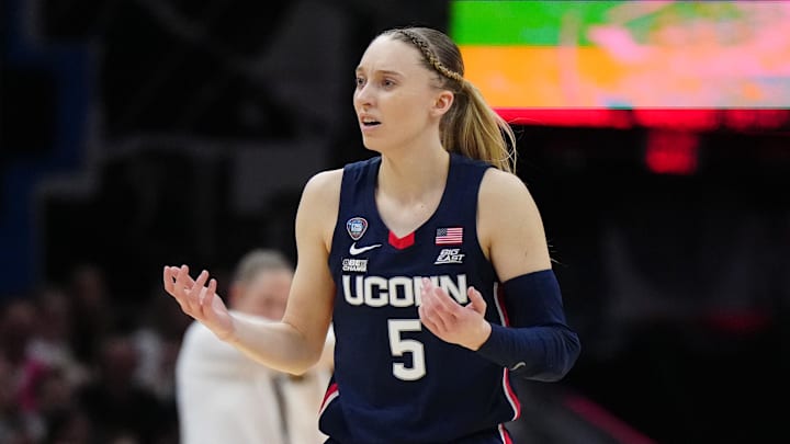 Apr 5, 2024; Cleveland, OH, USA; Connecticut Huskies guard Paige Bueckers (5) reacts in the second quarter against the Iowa Hawkeyes in the semifinals of the Final Four of the womens 2024 NCAA Tournament at Rocket Mortgage FieldHouse. Mandatory Credit: Kirby Lee-Imagn Images