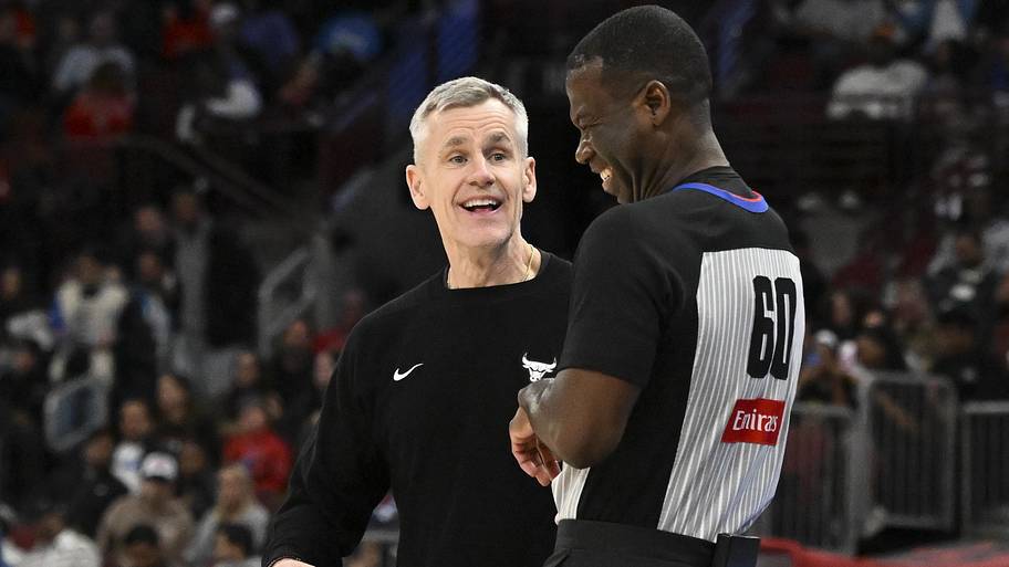 Chicago Bulls coach Billy Donovan laughs with an official.