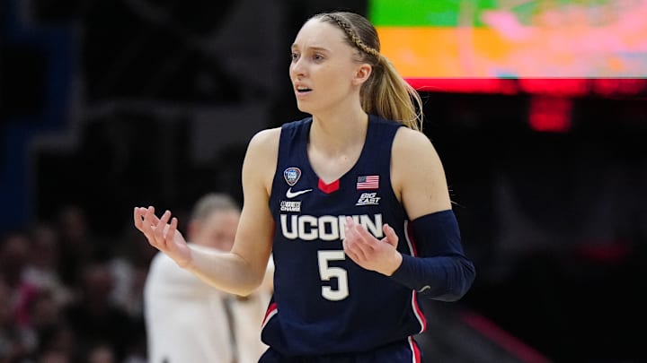 Apr 5, 2024; Cleveland, OH, USA; Connecticut Huskies guard Paige Bueckers (5) reacts in the second quarter against the Iowa Hawkeyes in the semifinals of the Final Four of the womens 2024 NCAA Tournament at Rocket Mortgage FieldHouse. Mandatory Credit: Kirby Lee-Imagn Images