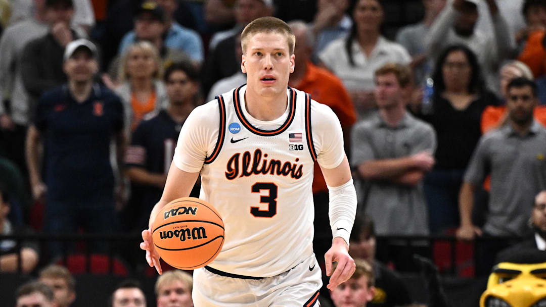 Illinois Fighting Illini forward Ben Humrichous (3) dribbles up the court against the Iowa Hawkeyes during the Elite Eight in the 2026 NCAA Tournament at Toyota Center.