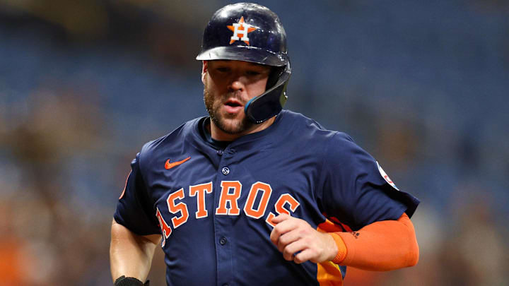 Aug 12, 2024; St. Petersburg, Florida, USA; Houston Astros outfielder Chas McCormick (20) scores a run against the Tampa Bay Rays in the third inning at Tropicana Field