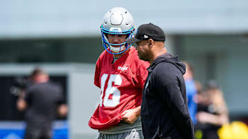 Detroit Lions quarterback Jared Goff (16) talks to passing game coordinator David Shaw at practice during OTAs at Meijer Performance Center in Allen Park on Friday, May 30, 2025.