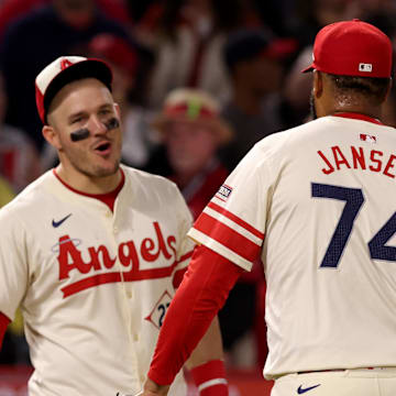 Jun 6, 2025; Anaheim, California, USA; Los Angeles Angels outfielder Mike Trout (27) and pitcher Kenley Jansen (74) celebrate after a win against the Seattle Mariners at Angel Stadium. Mandatory Credit: Jason Parkhurst-Imagn Images