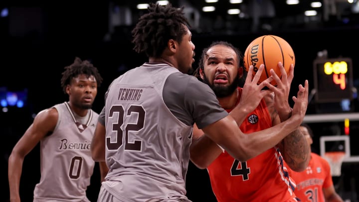 Nov 17, 2023; Brookyln, NY, USA; Auburn Tigers forward Johni Broome (4) is fouled as he drives to the basket by St. Bonaventure Bonnies forward Chad Venning (32) during the second half at Barclays Center. Mandatory Credit: Brad Penner-USA TODAY Sports