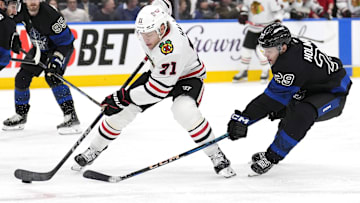 Dec 2, 2024; Toronto, Ontario, CAN; Chicago Blackhawks forward Taylor Hall (71) controls the puck as Toronto Maple Leafs forward Pontus Holmberg (29) defends during the second period at Scotiabank Arena. Mandatory Credit: John E. Sokolowski-Imagn Images