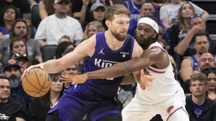 March 16, 2024; Sacramento, California, USA; Sacramento Kings forward Domantas Sabonis (10) dribbles the basketball against New York Knicks forward Precious Achiuwa (5) during the second quarter at Golden 1 Center. Mandatory Credit: Kyle Terada-USA TODAY Sports