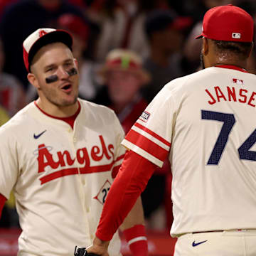 Jun 6, 2025; Anaheim, California, USA; Los Angeles Angels outfielder Mike Trout (27) and pitcher Kenley Jansen (74) celebrate after a win against the Seattle Mariners at Angel Stadium. Mandatory Credit: Jason Parkhurst-Imagn Images