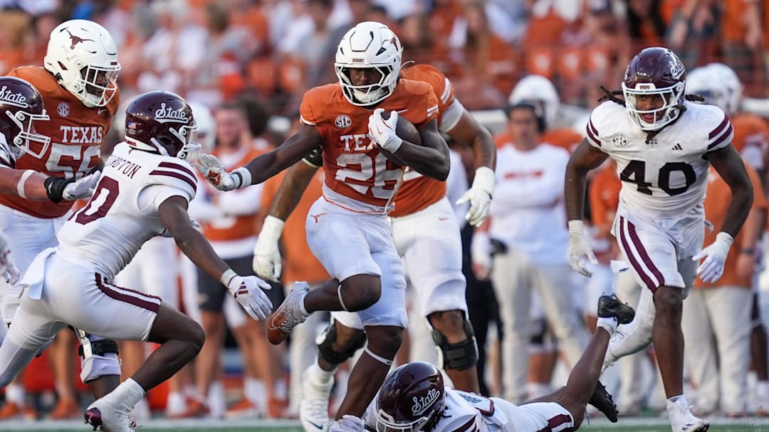 Texas Longhorns running back Quintrevion Wisner (26) tries to fend off Mississippi State Bulldogs safety Corey Ellington (10), Sept. 28, 2025 at Darrell K Royal-Texas Memorial Stadium in Austin, Texas.