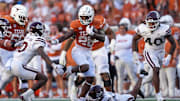 Texas Longhorns running back Quintrevion Wisner (26) tries to fend off Mississippi State Bulldogs safety Corey Ellington (10), Sept. 28, 2025 at Darrell K Royal-Texas Memorial Stadium in Austin, Texas.