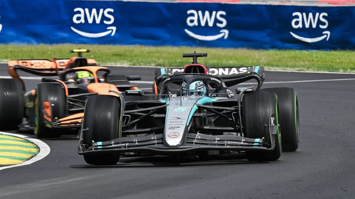 Jun 9, 2024; Montreal, Quebec, CAN; Mercedes driver George Russell (GBR) races ahead of McLaren driver Lando Norris (GBR) during the Canadian Grand Prix at Circuit Gilles Villeneuve. Mandatory Credit: David Kirouac-USA TODAY Sports