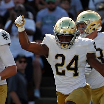 Notre Dame Fighting Irish quarterback Riley Leonard (13) celebrates after scoring a touchdown Saturday, Sept. 14, 2024, during the NCAA football game against the Purdue Boilermakers at Ross-Ade Stadium in West Lafayette, Ind.