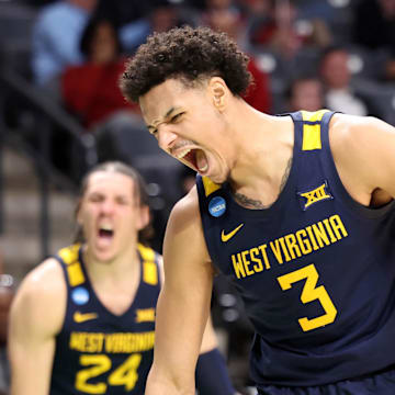 Mar 16, 2023; Birmingham, AL, USA; West Virginia Mountaineers forward Tre Mitchell (3) reacts after scoring a basket while being fouled against the Maryland Terrapins during the second half in the first round of the 2023 NCAA Tournament at Legacy Arena. Mandatory Credit: Vasha Hunt-Imagn Images