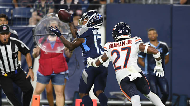 Aug 28, 2021; Nashville, TN, USA; Tennessee Titans wide receiver Cameron Batson (13) catches a touchdown pass against Chicago Bears cornerback Thomas Graham Jr. (27) during the second half at Nissan Stadium. Mandatory Credit: Christopher Hanewinckel-Imagn Images