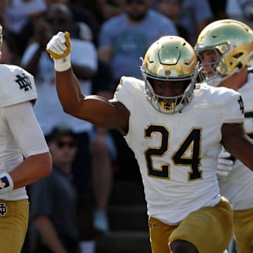 Notre Dame Fighting Irish quarterback Riley Leonard (13) celebrates after scoring a touchdown Saturday, Sept. 14, 2024, during the NCAA football game against the Purdue Boilermakersat Ross-Ade Stadium in West Lafayette, Ind.