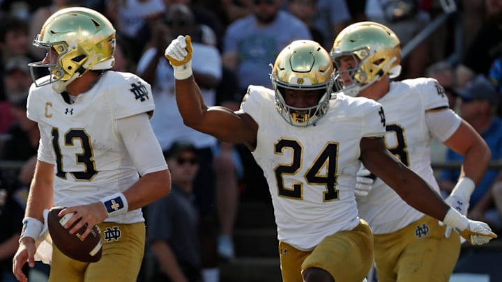 Notre Dame Fighting Irish quarterback Riley Leonard (13) celebrates after scoring a touchdown Saturday, Sept. 14, 2024, during the NCAA football game against the Purdue Boilermakersat Ross-Ade Stadium in West Lafayette, Ind.