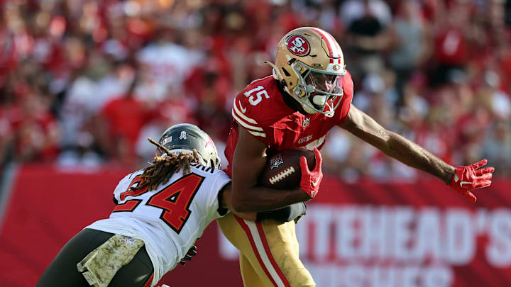 San Francisco 49ers wide receiver Jauan Jennings (15) runs with the ball as Tampa Bay Buccaneers cornerback Tyrek Funderburk (24) San Francisco 49ers wide receiver Jauan Jennings (15) runs with the ball as Tampa Bay Buccaneers cornerback Tyrek Funderburk (24)