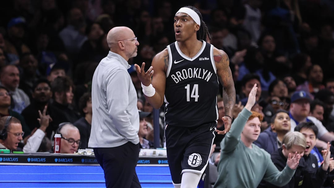 Feb 24, 2026; Brooklyn, New York, USA; Brooklyn Nets guard Terance Mann (14) reacts after making a three point shot in the fourth quarter against the Dallas Mavericks at Barclays Center. Mandatory Credit: Wendell Cruz-Imagn Images