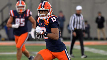 Nov 16, 2024; Champaign, Illinois, USA; Illinois Fighting Illini wide receiver Pat Bryant (13) runs with the ball after a catch during the second half against the Michigan State Spartans at Memorial Stadium. Mandatory Credit: Ron Johnson-Imagn Images