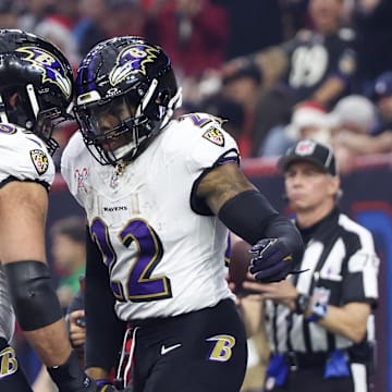 Dec 25, 2024; Houston, Texas, USA; Baltimore Ravens guard Patrick Mekari (65) celebrates  running back Derrick Henry (22) rushing touchdown against the Houston Texans  in the first quarter at NRG Stadium. Mandatory Credit: Thomas Shea-Imagn Images