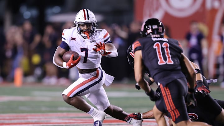 Sep 28, 2024; Salt Lake City, Utah, USA; Arizona Wildcats running back Quali Conley (7) runs against the Utah Utes during the third quarter at Rice-Eccles Stadium. Mandatory Credit: Rob Gray-Imagn Images