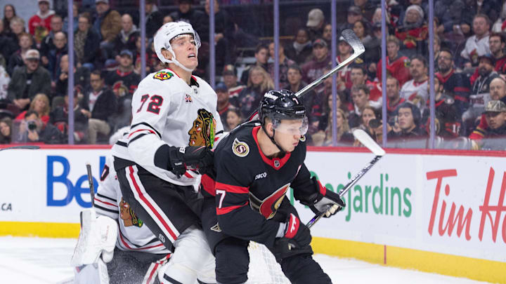 Dec 20, 2025; Ottawa, Ontario, CAN; Chicago Blackhawks defenseman Alex Vlasic (72) battles with Ottawa Senators left wing Brady Tkachuk (7) during the first period at the Canadian Tire Centre. Mandatory Credit: Marc DesRosiers-IMAGN Images