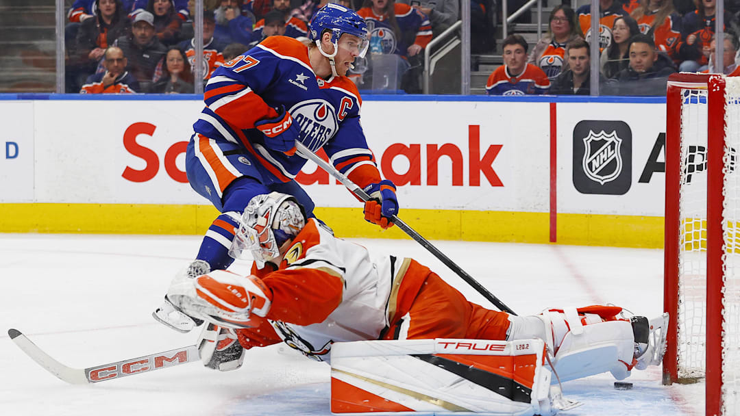 Mar 4, 2025; Edmonton, Alberta, CAN; Edmonton Oilers forward Connor McDavid (97) scores a goal on Anaheim Ducks goaltender Lucas Dostal (1) during the third period at Rogers Place. Mandatory Credit: Perry Nelson-Imagn Images