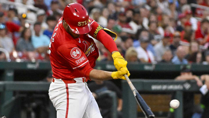 Aug 7, 2024; St. Louis, Missouri, USA;  St. Louis Cardinals third baseman Nolan Arenado (28) hits a two run single against the Tampa Bay Rays during the third inning at Busch Stadium. Mandatory Credit: Jeff Curry-USA TODAY Sports