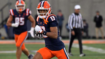 Nov 16, 2024; Champaign, Illinois, USA; Illinois Fighting Illini wide receiver Pat Bryant (13) runs with the ball after a catch during the second half against the Michigan State Spartans at Memorial Stadium. 