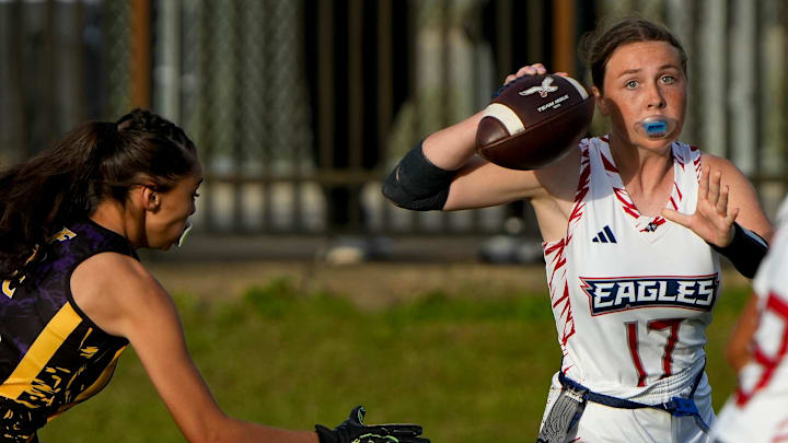 Centennial's Miley McCarty (17) defends the ball against Fort Pierce Central during a girls flag football game, Tuesday, March 4, 2025, at Fort Pierce Central High School.