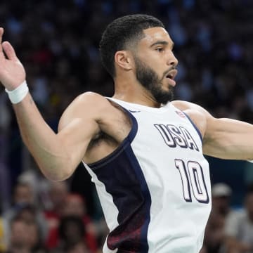 Jul 31, 2024; Villeneuve-d'Ascq, France; United States small forward Jayson Tatum (10) grabs a rebound in the first quarter against South Sudan during the Paris 2024 Olympic Summer Games at Stade Pierre-Mauroy. Mandatory Credit: John David Mercer-USA TODAY Sports