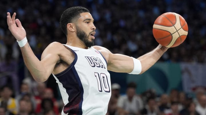 Jul 31, 2024; Villeneuve-d'Ascq, France; United States small forward Jayson Tatum (10) grabs a rebound in the first quarter against South Sudan during the Paris 2024 Olympic Summer Games at Stade Pierre-Mauroy. Mandatory Credit: John David Mercer-USA TODAY Sports