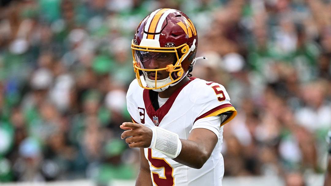 Sep 13, 2026; Philadelphia, Pennsylvania, USA;  Washington Commanders quarterback Jayden Daniels (5) directs the offense against the Philadelphia Eagles during the first half at Lincoln Financial Field.  Mandatory Credit: Eric Hartline-Imagn Images