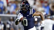 Aug 31, 2024; Oxford, Mississippi, USA; Mississippi Rebels running back Matt Jones (0) runs the ball for a touchdown during the second half against the Furman Paladins at Vaught-Hemingway Stadium. Mandatory Credit: Petre Thomas-Imagn Images