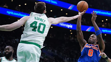 New York Knicks forward OG Anunoby (8) shoots the ball against Boston Celtics center Luke Kornet (40) in the second quarter during game one of the second round for the 2025 NBA Playoffs at TD Garden.