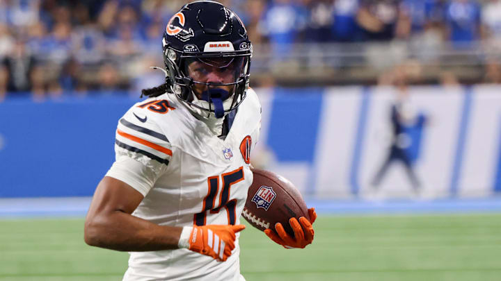 Chicago Bears wide receiver Rome Odunze (15) carries the ball for a touchdown against the Detroit Lions during the first quarter at Ford Field.