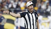NFL referee Shawn Hochuli signals a penalty on the Dallas Cowboys against the Pittsburgh Steelers 