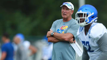 Kansas coach Lance Leipold watches players during practice at the outdoor practice fields in Lawrence on July 24, 2025.