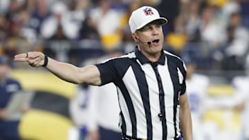 Oct 6, 2024; Pittsburgh, Pennsylvania, USA;  NFL referee Shawn Hochuli (83) signals a penalty on the Dallas Cowboys against the Pittsburgh Steelers during the third quarter at Acrisure Stadium. Mandatory Credit: Charles LeClaire-Imagn Images