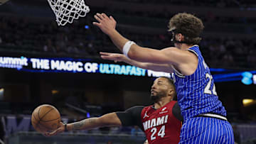 Dec 5, 2025; Orlando, Florida, USA; Miami Heat guard Norman Powell (24) shoots the ball under Orlando Magic forward Franz Wagner (22) in the first quarter at Kia Center. Mandatory Credit: Nathan Ray Seebeck-Imagn Images