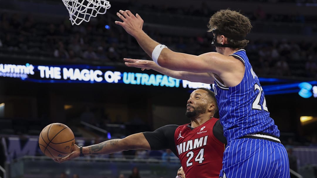 Dec 5, 2025; Orlando, Florida, USA; Miami Heat guard Norman Powell (24) shoots the ball under Orlando Magic forward Franz Wagner (22) in the first quarter at Kia Center. Mandatory Credit: Nathan Ray Seebeck-Imagn Images Dec 5, 2025; Orlando, Florida, USA; Miami Heat guard Norman Powell (24) shoots the ball under Orlando Magic forward Franz Wagner (22) in the first quarter at Kia Center. Mandatory Credit: Nathan Ray Seebeck-Imagn Images