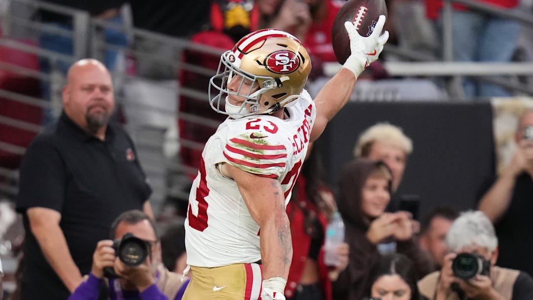 San Francisco 49ers running back Christian McCaffrey (23) spikes the ball after running in a touchdown against the Arizona Cardinals at State Farm Stadium in Glendale on Nov. 16, 2025.