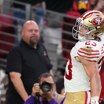 San Francisco 49ers running back Christian McCaffrey (23) spikes the ball after running in a touchdown against the Arizona Cardinals at State Farm Stadium in Glendale on Nov. 16, 2025.